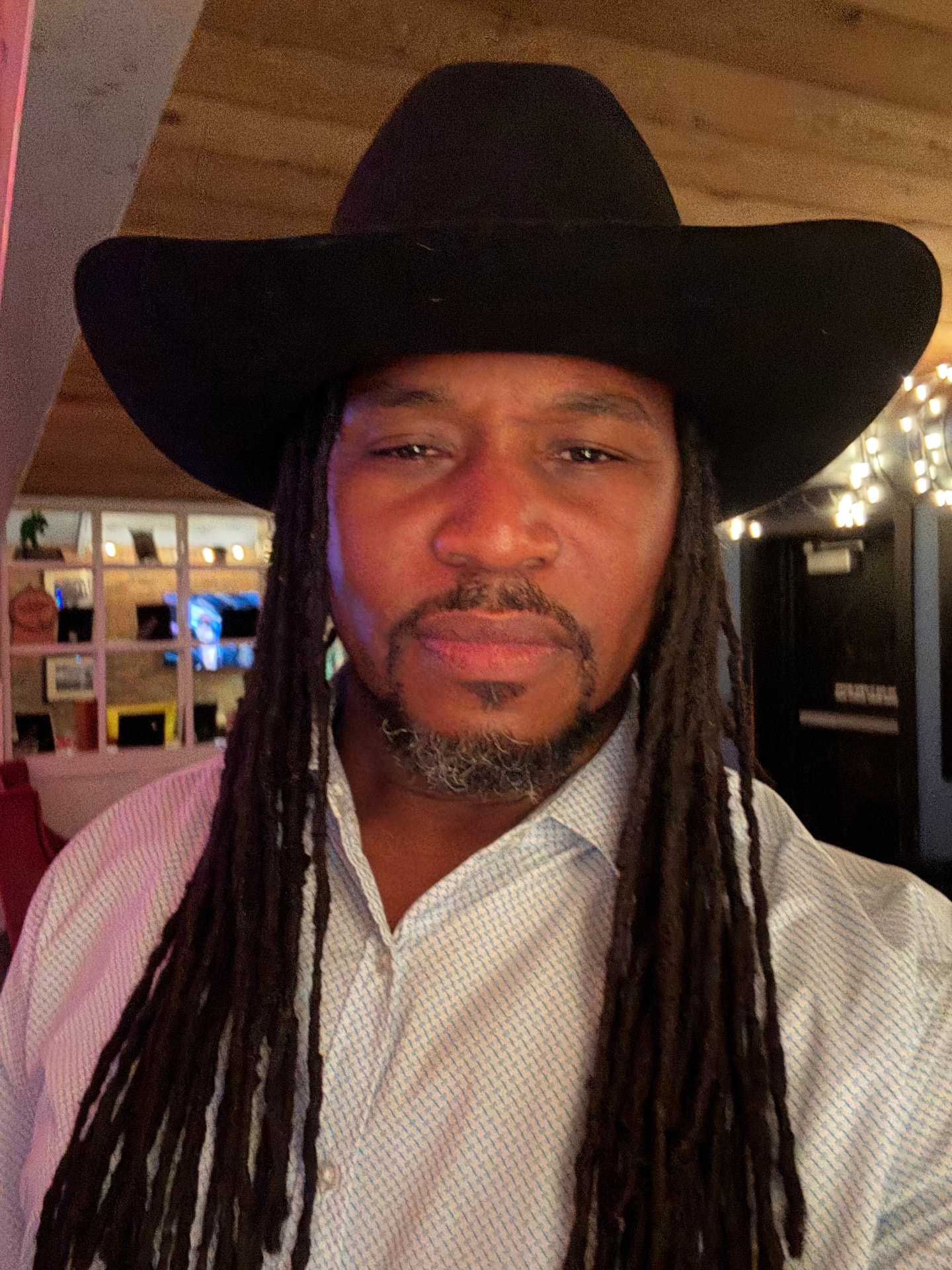 THA PARTY KING in a black cowboy hat