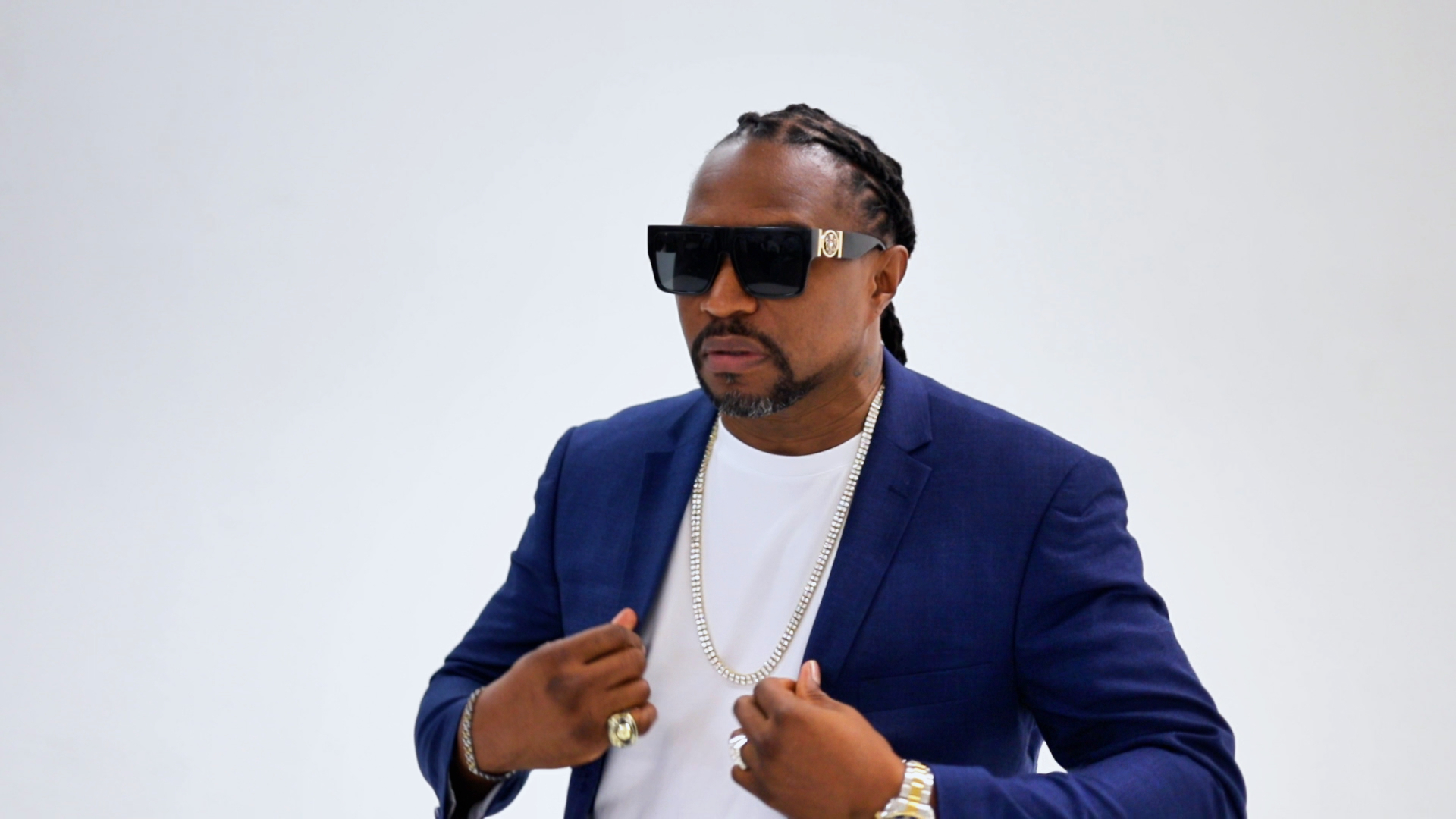 THA PARTY KING in a blue suit press photo